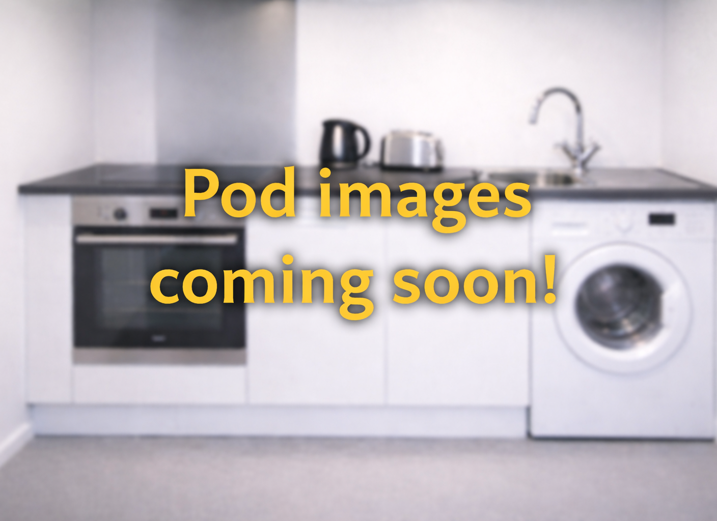 Mobile Kitchen trailer featuring a kettle, oven, sink and washing machine.